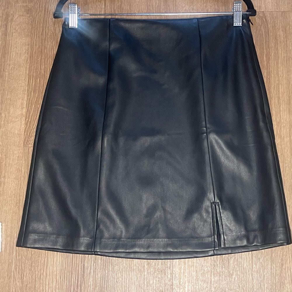NWT Loft black pleather mini skirt. Never worn. Lined with slip.